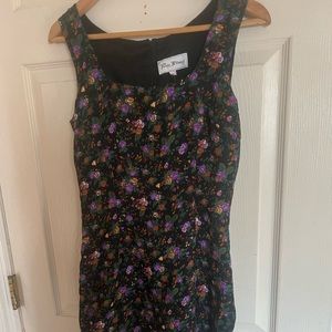 I am selling a small black dress with purple flowers from RatResale for $25.